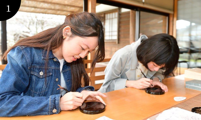 The design is copied onto the ware and etched along the line with a steel pen.